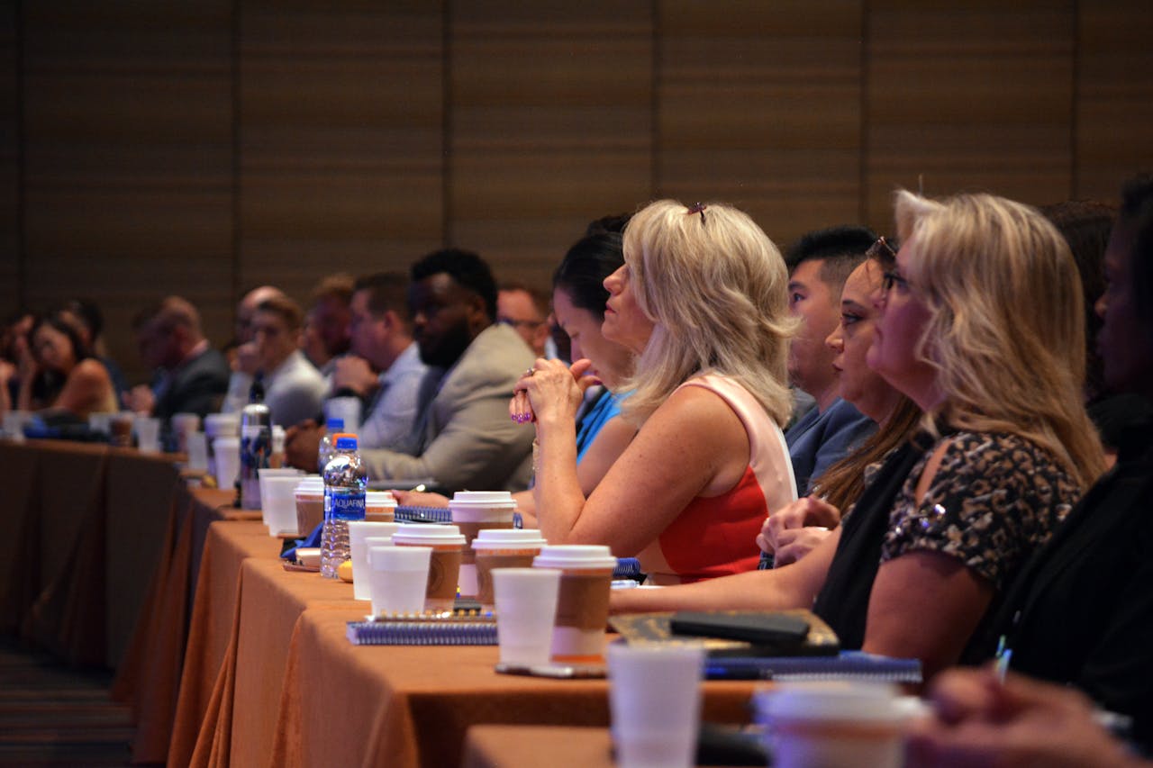 services-01 Diverse group of business professionals attentive during a conference session in a meeting room.